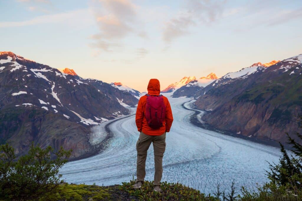hiker looking over salmon glacier